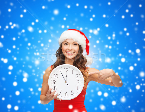 Uśmiechnięta kobieta Święty mikołaj pomocnik hat zegar christmas Zdjęcia stock © dolgachov