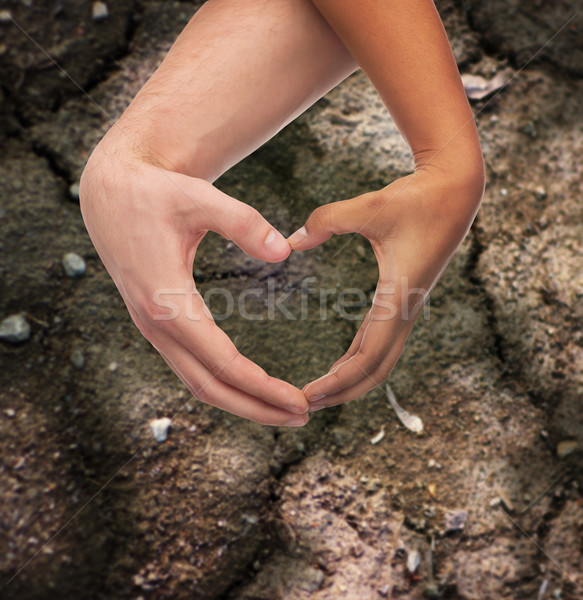 Nő férfi kezek mutat szív alak szeretet Stock fotó © dolgachov