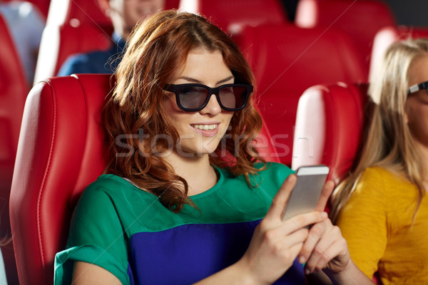 happy woman with smartphone in 3d movie theater Stock photo © dolgachov