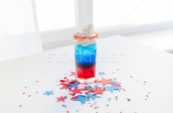 glass of drink on american independence day party Stock photo © dolgachov