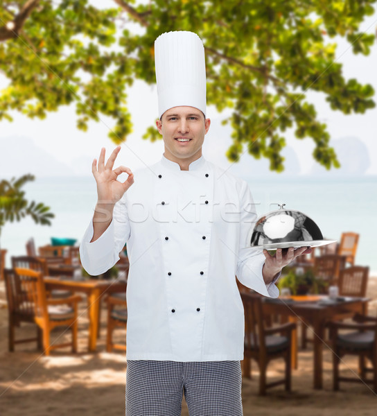 happy male chef cook with cloche showing ok sign Stock photo © dolgachov