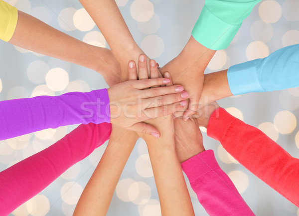 close up of women hands on top in rainbow clothes Stock photo © dolgachov