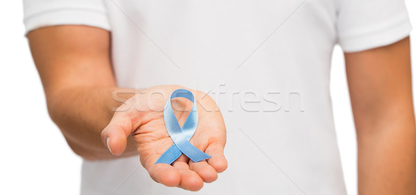 Mână albastru prostata cancer constientizare panglică Imagine de stoc © dolgachov