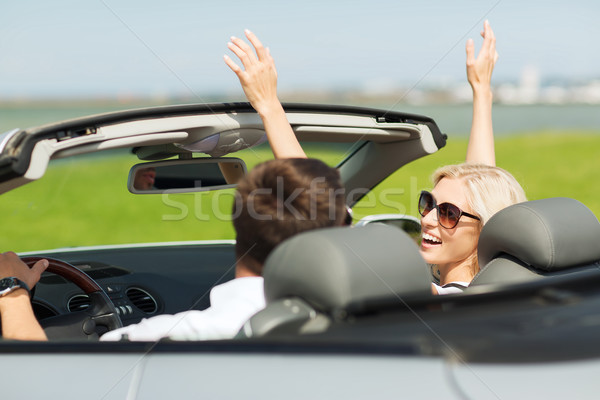 happy man and woman driving in cabriolet car Stock photo © dolgachov