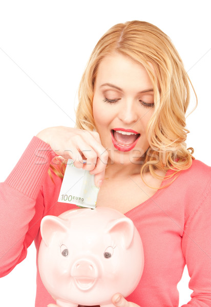 lovely woman with piggy bank and money Stock photo © dolgachov