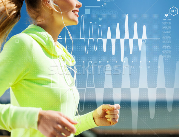 Stock photo: smiling woman doing running outdoors