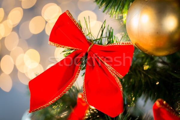 close up of red bow decoration on christmas tree Stock photo © dolgachov