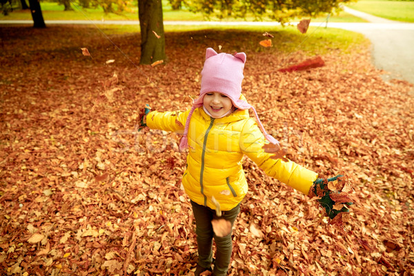 happy girl playing with autumn leaves in park Stock photo © dolgachov