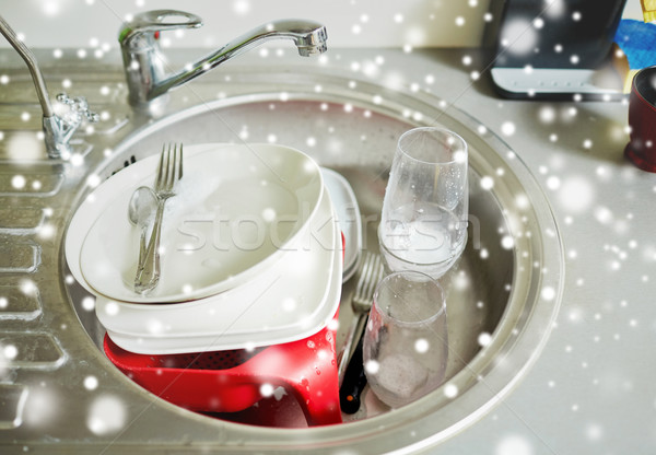 close up of dirty dishes washing in kitchen sink Stock photo © dolgachov