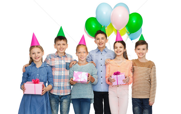 happy children with gifts on birthday party Stock photo © dolgachov