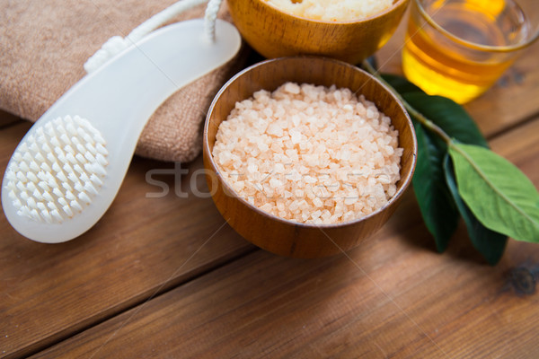 close up of himalayan pink salt with brush on wood Stock photo © dolgachov