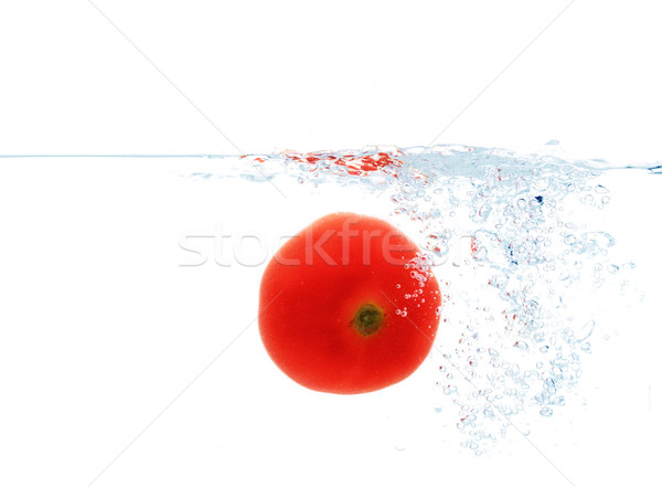 tomato falling or dipping in water with splash Stock photo © dolgachov
