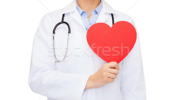 female doctor with heart and stethoscope Stock photo © dolgachov