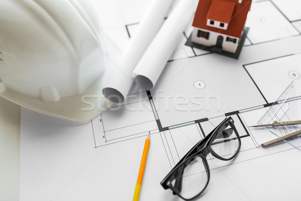 Stock photo: close up of architectural blueprint and tools