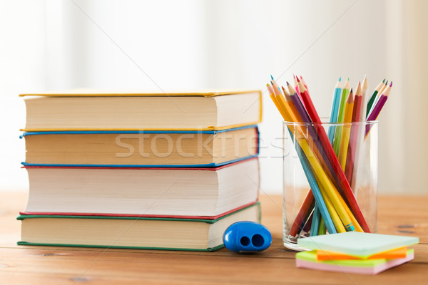 close up of crayons or color pencils and books Stock photo © dolgachov