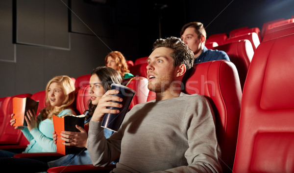 friends watching horror movie in theater Stock photo © dolgachov