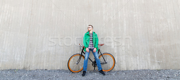 happy young hipster man with fixed gear bike Stock photo © dolgachov