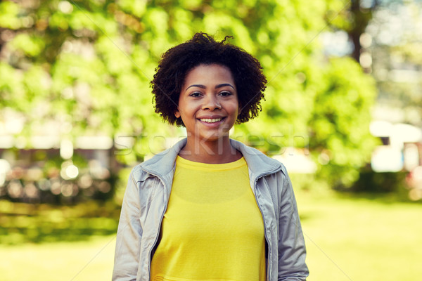 happy african american young woman in summer park Stock photo © dolgachov