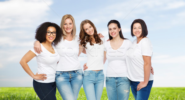 group of happy different women in white t-shirts Stock photo © dolgachov