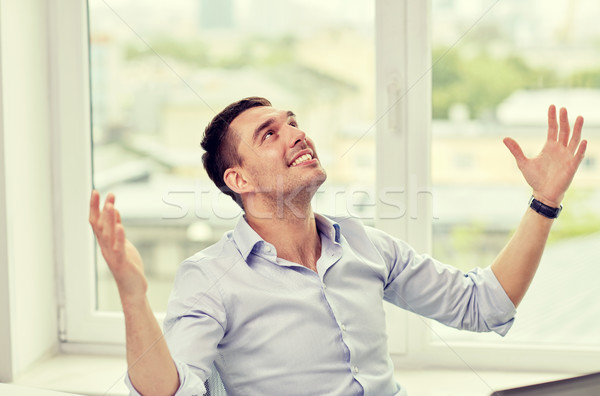 Stock photo: happy businessman with laptop in office