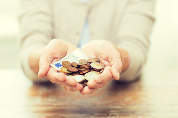 close up of senior woman hands holding money Stock photo © dolgachov