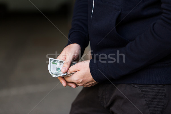 close up of addict or drug dealer hands with money Stock photo © dolgachov
