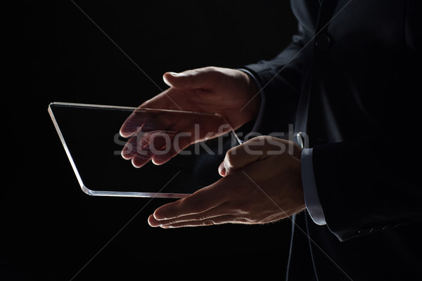 close up of businessman with transparent tablet pc Stock photo © dolgachov