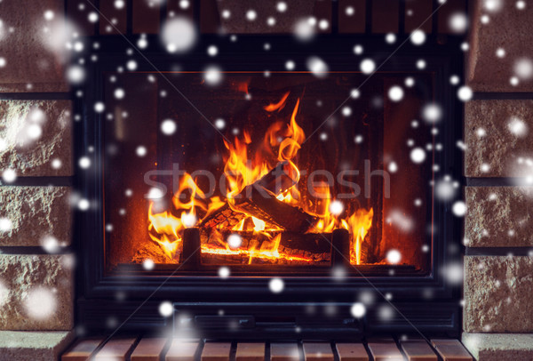 close up of burning fireplace with snow Stock photo © dolgachov