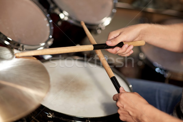 Stock photo: male musician playing drums and cymbals at concert