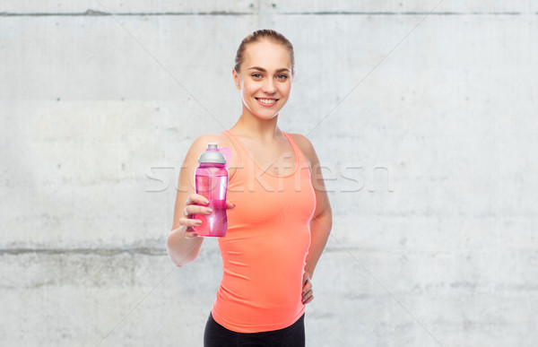 happy sportive young woman with water bottle Stock photo © dolgachov