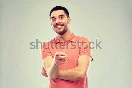 man pointing finger to you over gray background Stock photo © dolgachov