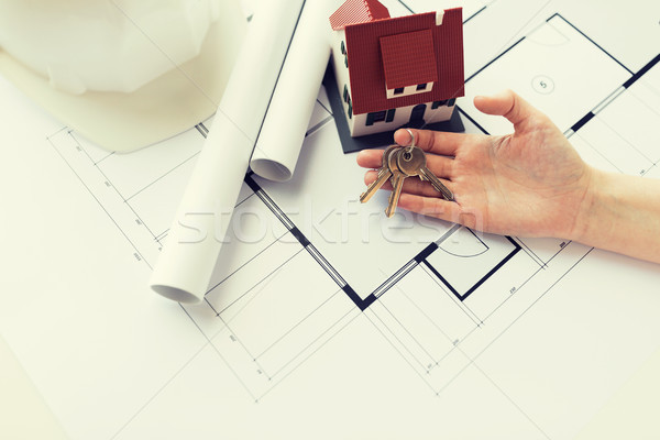 close up of hand with house keys and blueprint Stock photo © dolgachov
