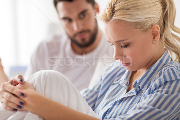 unhappy couple having conflict in bed at home Stock photo © dolgachov