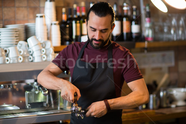 barista man making espresso at bar or coffee shop Stock photo © dolgachov