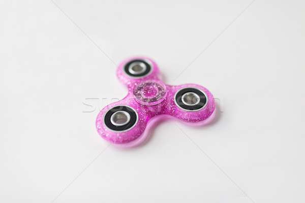 pink glittered fidget spinner Stock photo © dolgachov