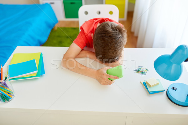 tired or sad student boy with smartphone at home Stock photo © dolgachov