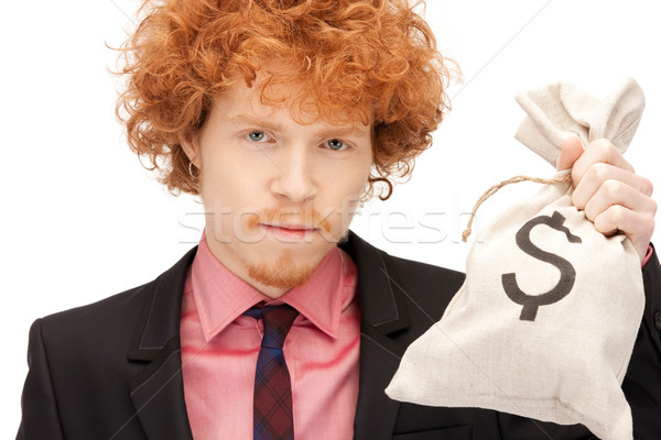 man with dollar signed bag Stock photo © dolgachov