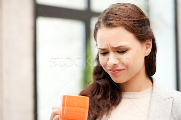 lovely businesswoman with mug Stock photo © dolgachov