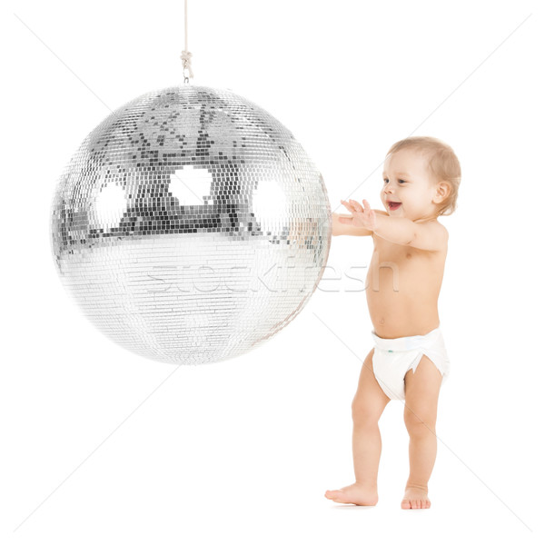 toddler playing with disco ball Stock photo © dolgachov