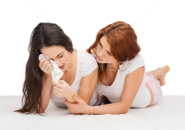 one teenage girl comforting another after break up Stock photo © dolgachov