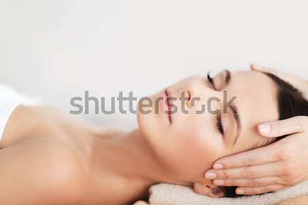 Stock photo: beautiful woman in spa salon having facial
