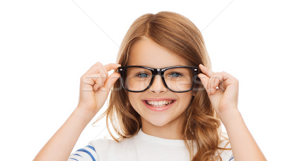 Souriant cute petite fille noir lunettes éducation [[stock_photo]] © dolgachov