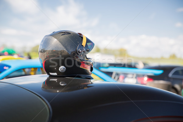 close up of car with helmet on roof top Stock photo © dolgachov
