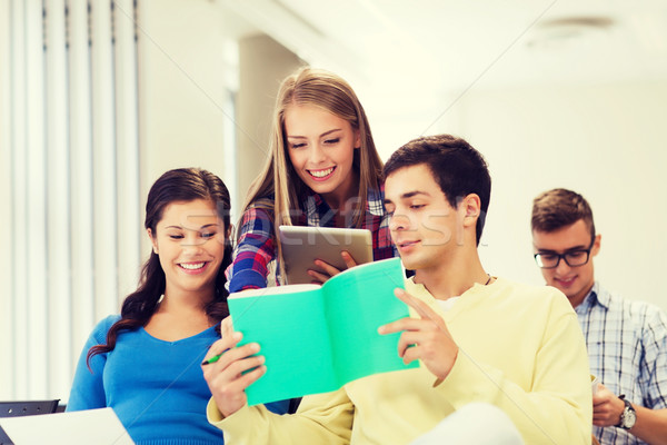 group of smiling students with tablet pc Stock photo © dolgachov