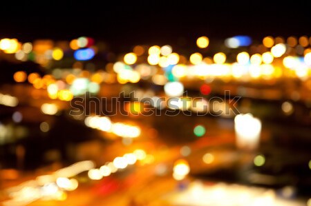 golden bright lights on dark night background Stock photo © dolgachov