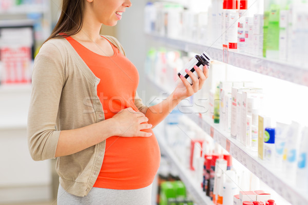 Szczęśliwy kobieta w ciąży lek apteki ciąży muzyka Zdjęcia stock © dolgachov