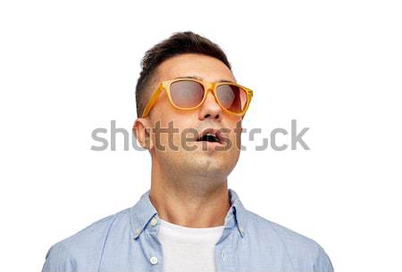 face of scared man in shirt and sunglasses Stock photo © dolgachov