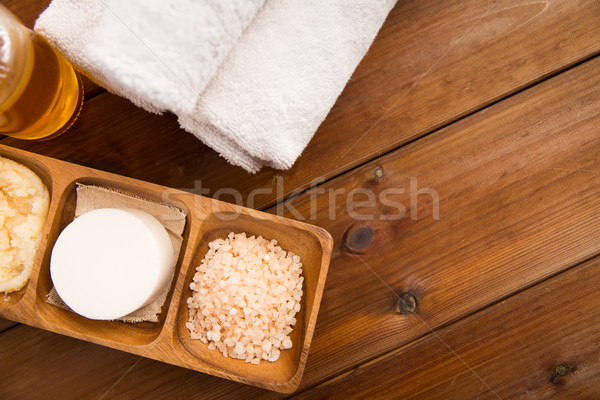 close up of natural cosmetics and bath towels Stock photo © dolgachov