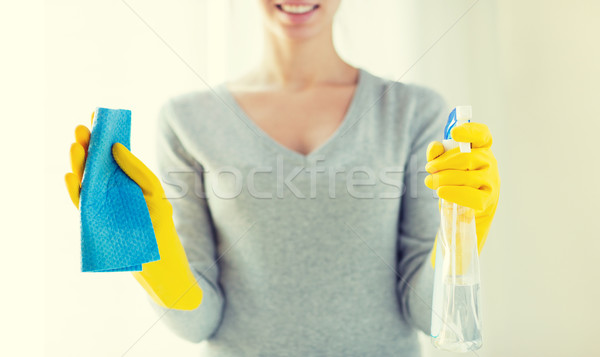 close up of happy woman with cloth and cleanser Stock photo © dolgachov