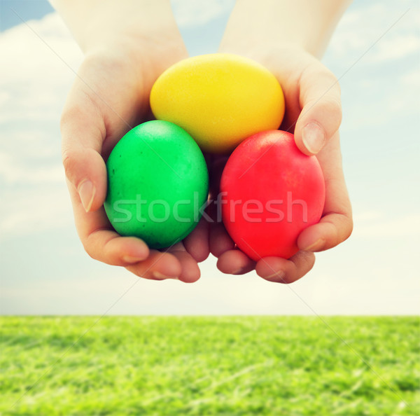 close up of kid hands holding colored eggs Stock photo © dolgachov